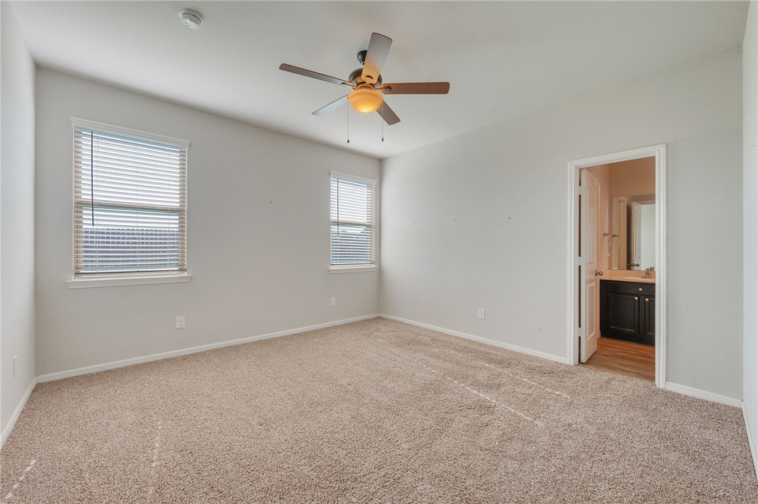 1700 Eagle View Drive Navasota, TX 77868 - Photo 7 of 22 a view of a livingroom with a ceiling fan and window