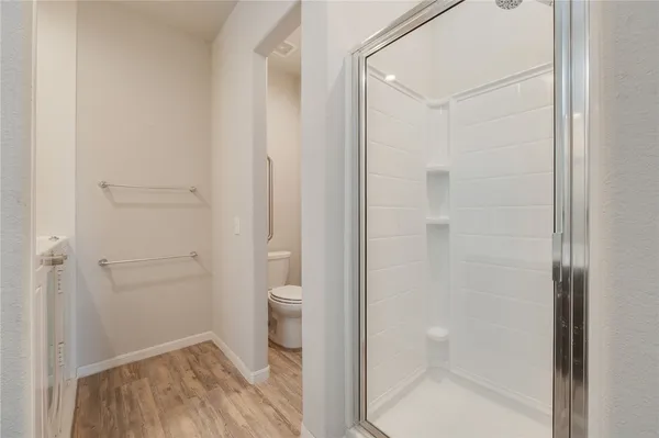 a bathroom with a granite countertop toilet