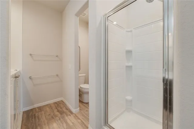 a bathroom with a granite countertop toilet