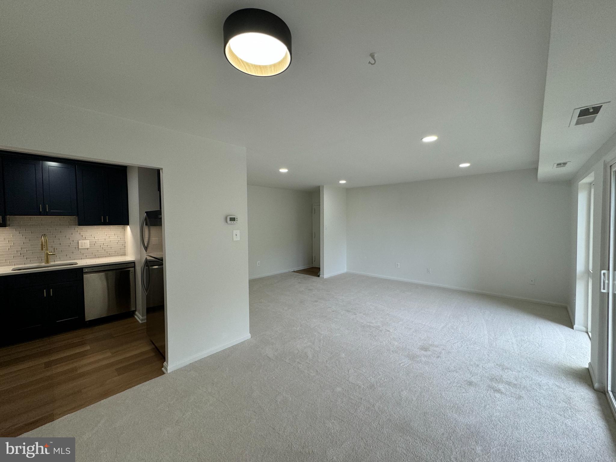 6135 Edsall Road, Unit N Alexandria, VA 22304 - Photo 3 of 9 a view of a kitchen with a sink and a stove top oven
