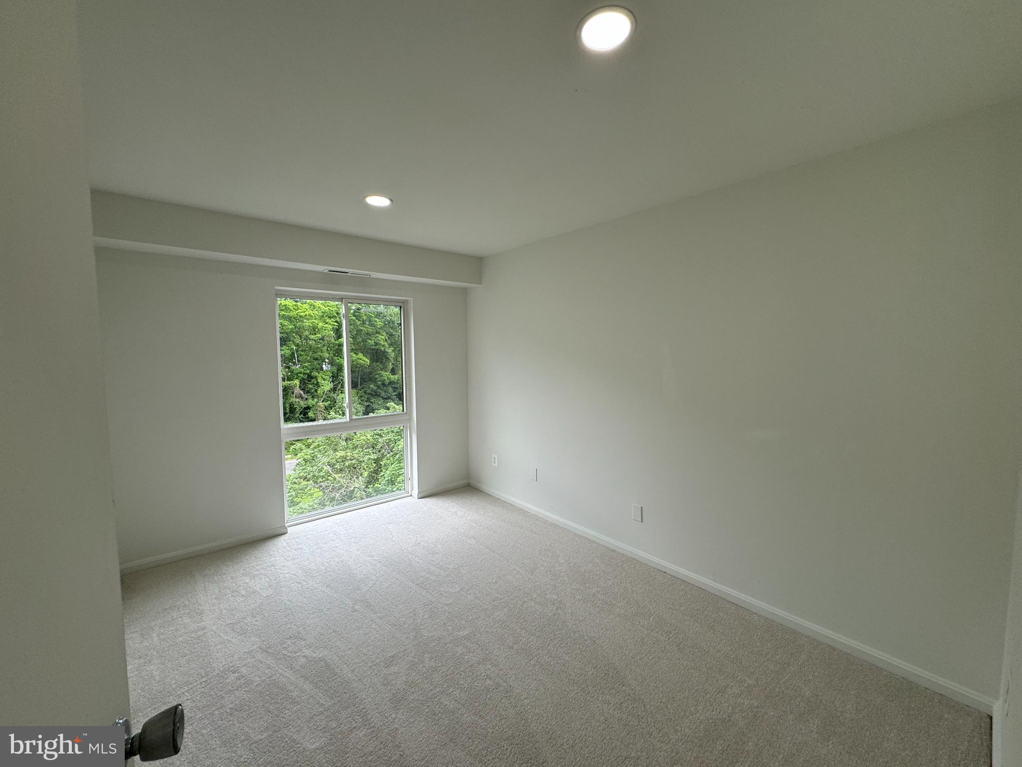 6135 Edsall Road, Unit N Alexandria, VA 22304 - Photo 7 of 9 a view of an empty room with a window