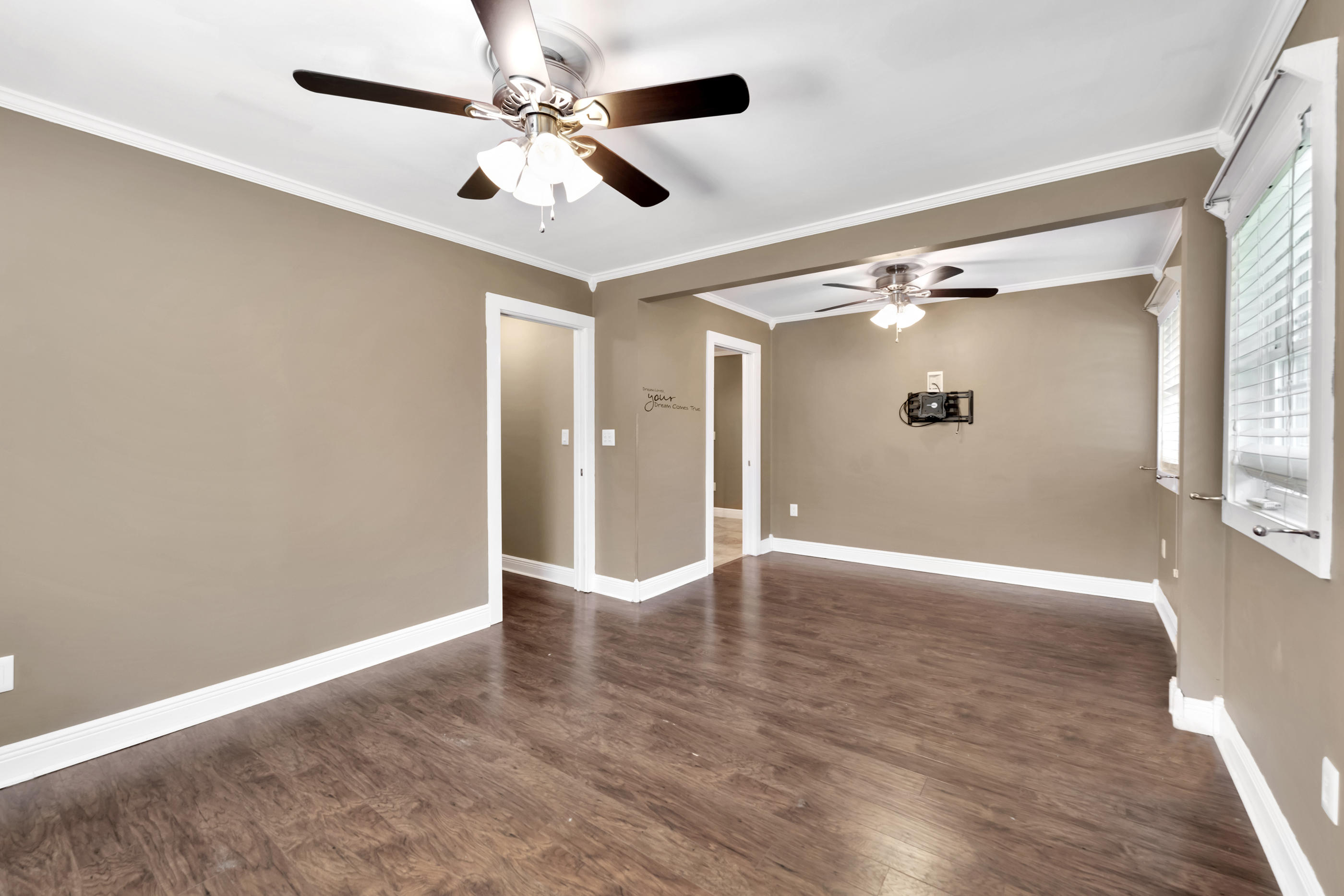 4 Roundabend Road Shalimar, FL 32579 - Photo 16 of 39 a view of an empty room with wooden floor and a window