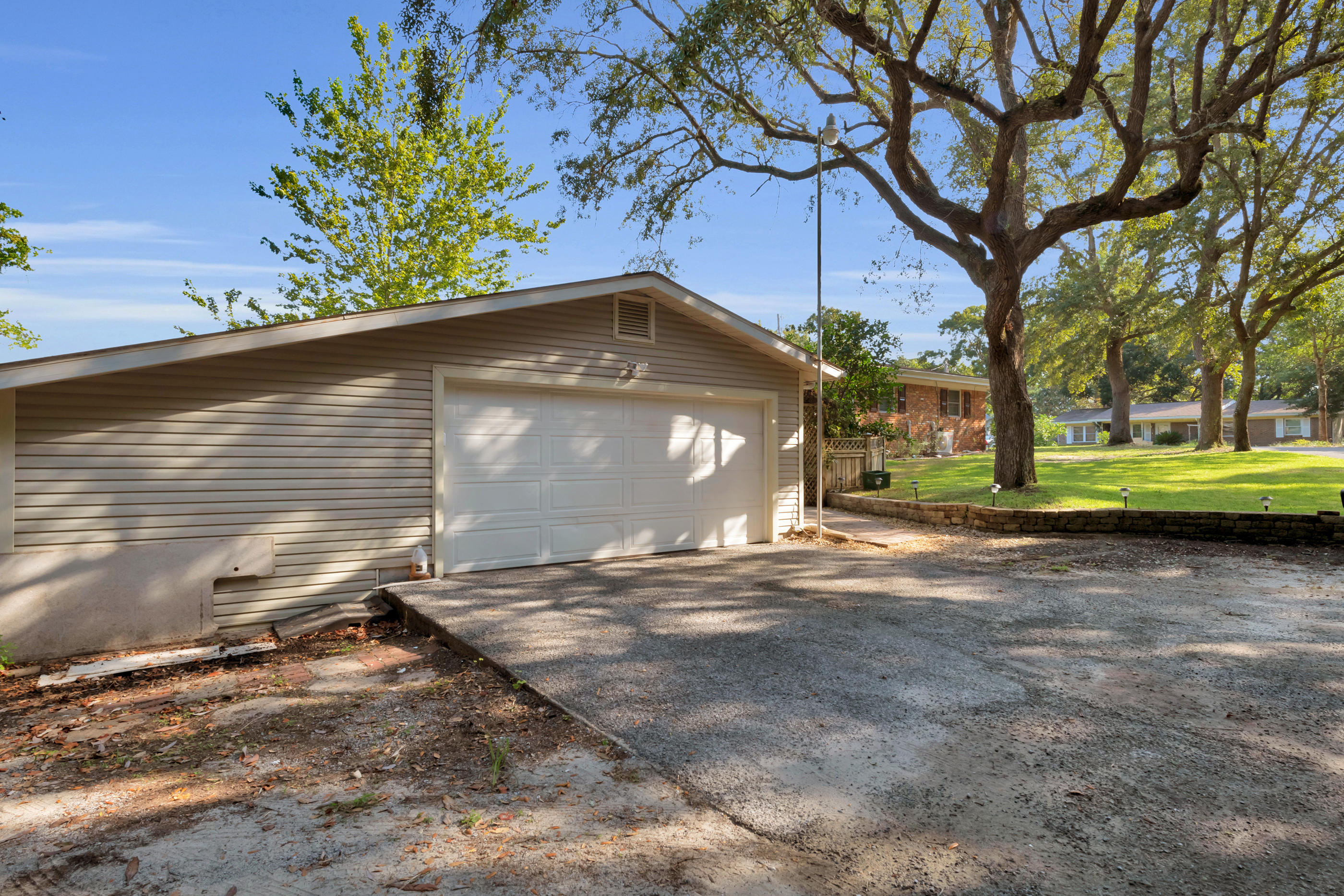 4 Roundabend Road Shalimar, FL 32579 - Photo 3 of 39 a front view of a house with a yard and garage