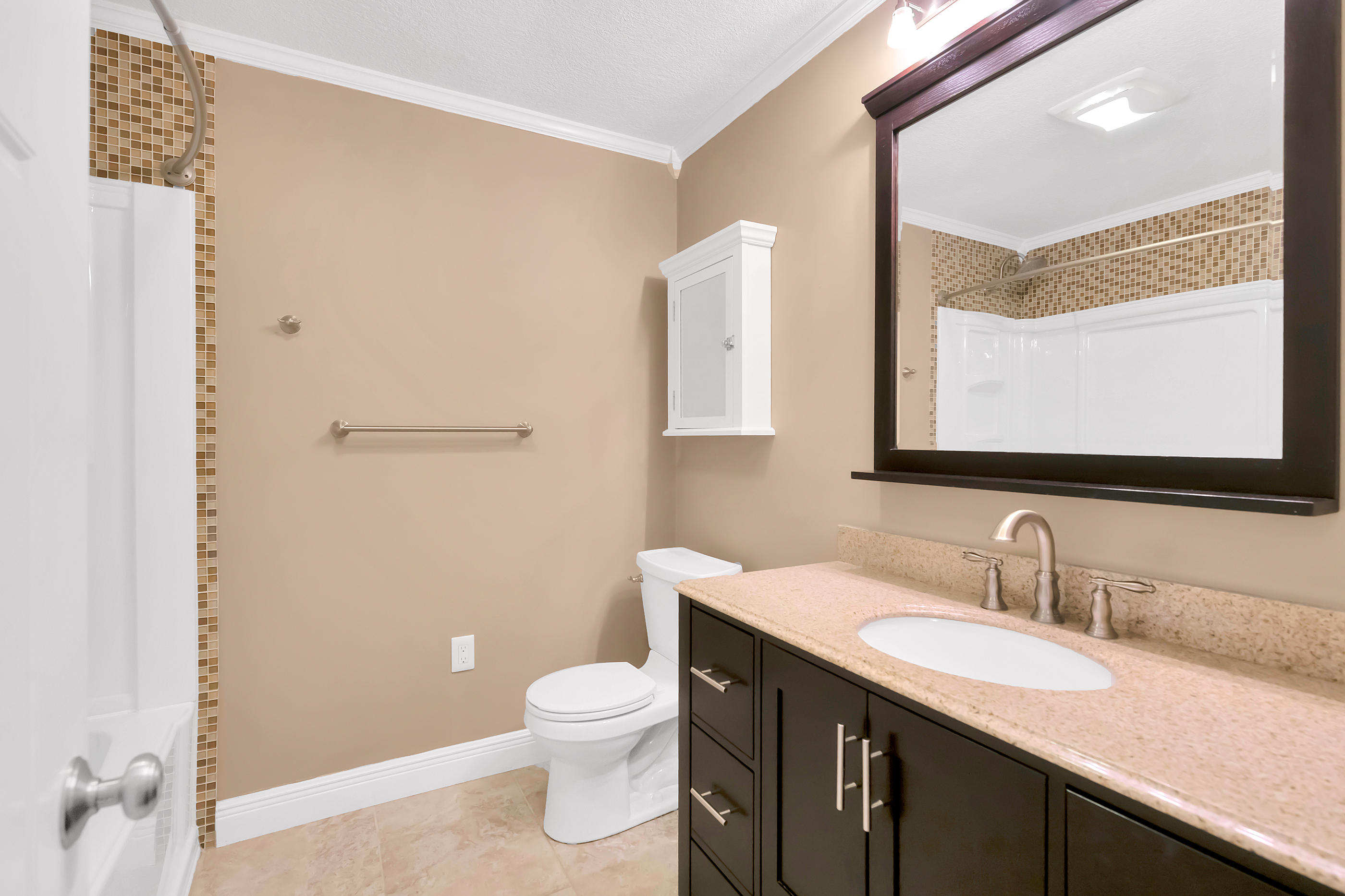 4 Roundabend Road Shalimar, FL 32579 - Photo 23 of 39 a bathroom with a granite countertop sink toilet and mirror