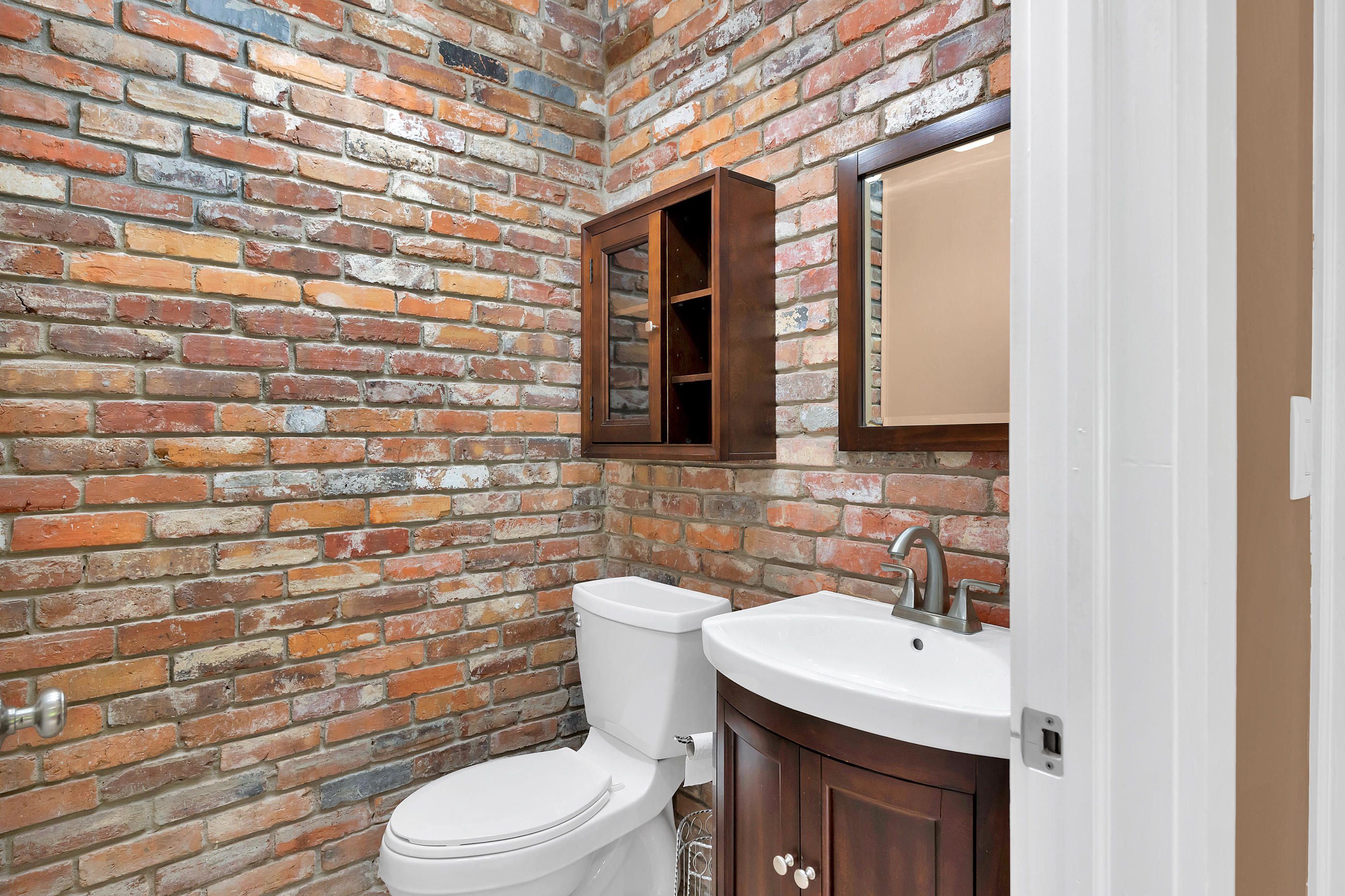 4 Roundabend Road Shalimar, FL 32579 - Photo 28 of 39 a bathroom with a sink a toilet and mirror