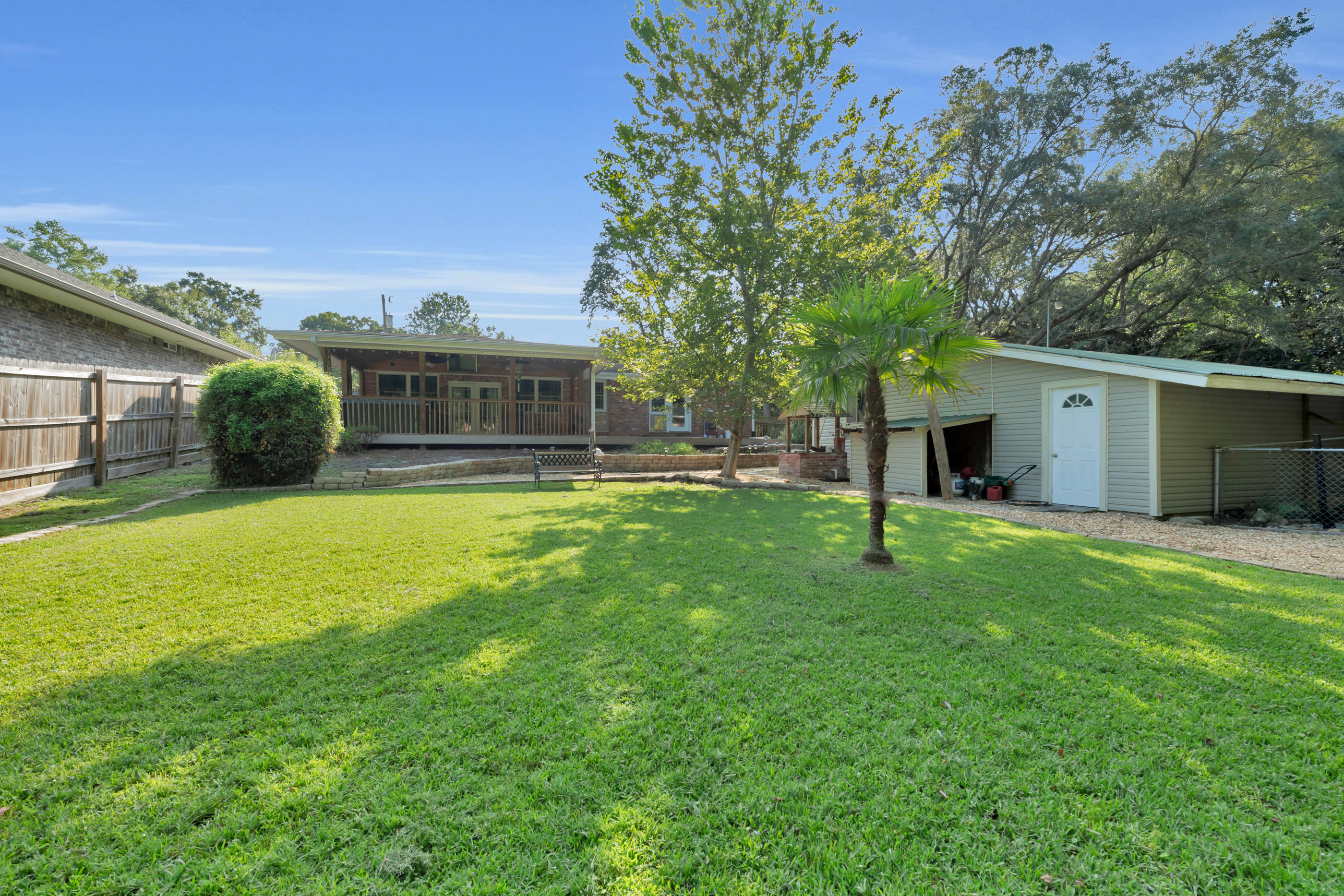 4 Roundabend Road Shalimar, FL 32579 - Photo 35 of 39 a view of a house with a yard and a patio