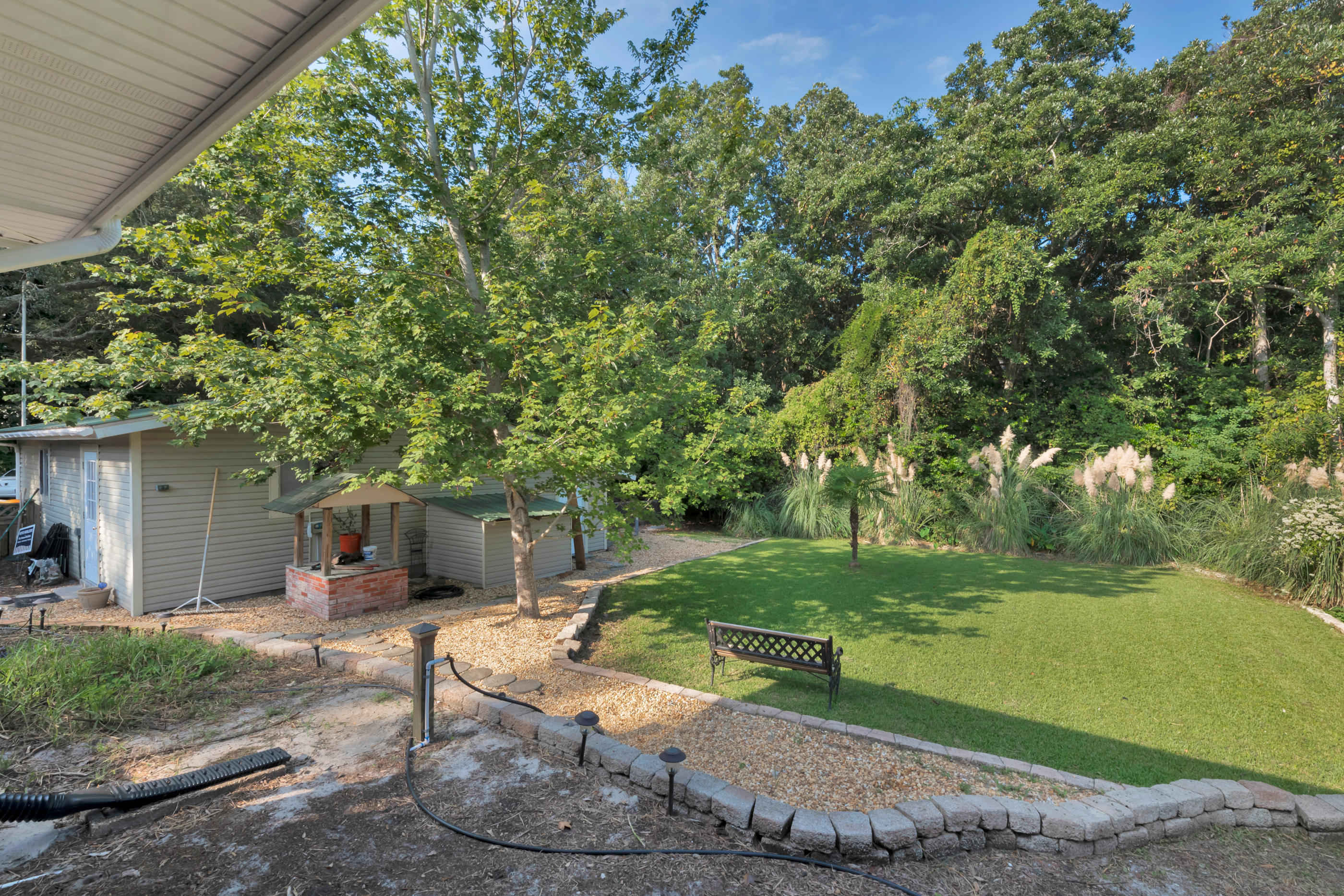 4 Roundabend Road Shalimar, FL 32579 - Photo 5 of 39 a view of a backyard with large trees