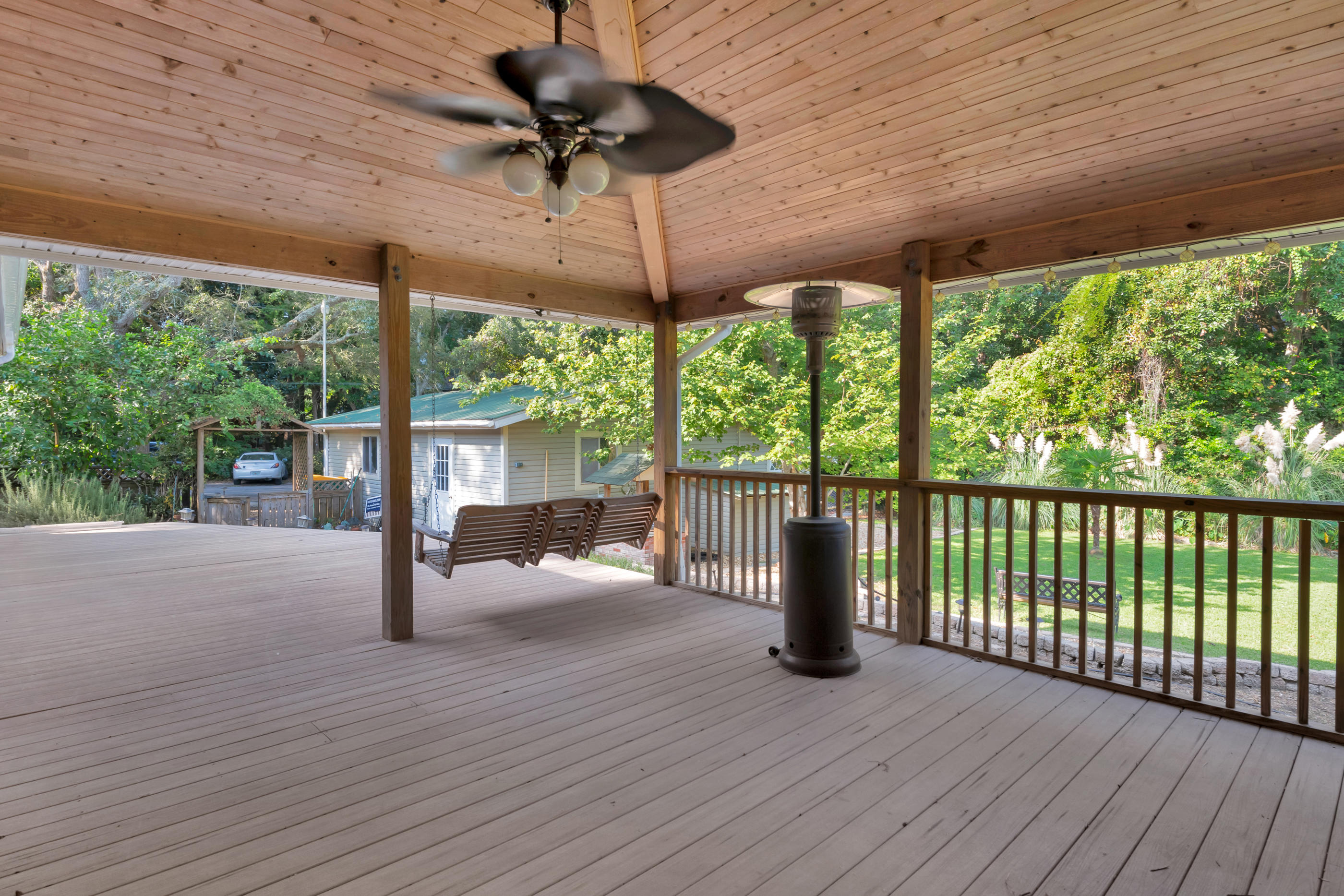 4 Roundabend Road Shalimar, FL 32579 - Photo 6 of 39 a view of a patio with a table chairs and wooden floor