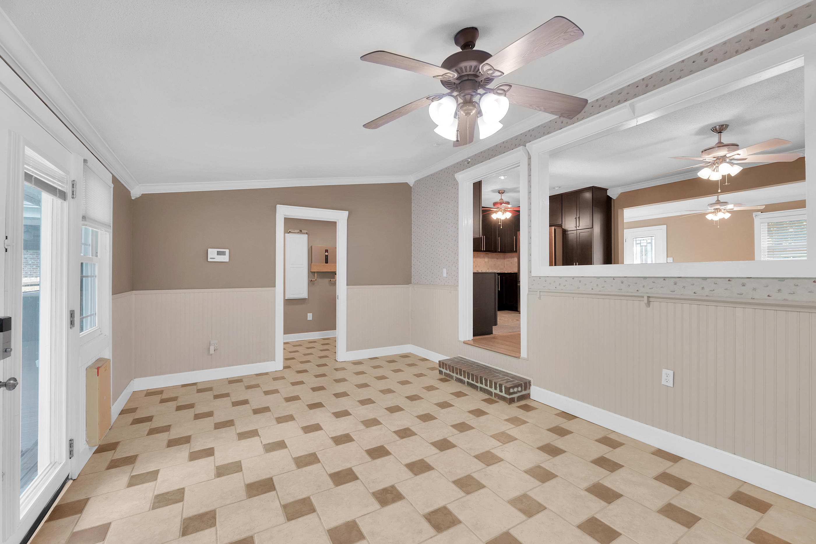 4 Roundabend Road Shalimar, FL 32579 - Photo 8 of 39 a view of a big room with a chandelier fan and windows