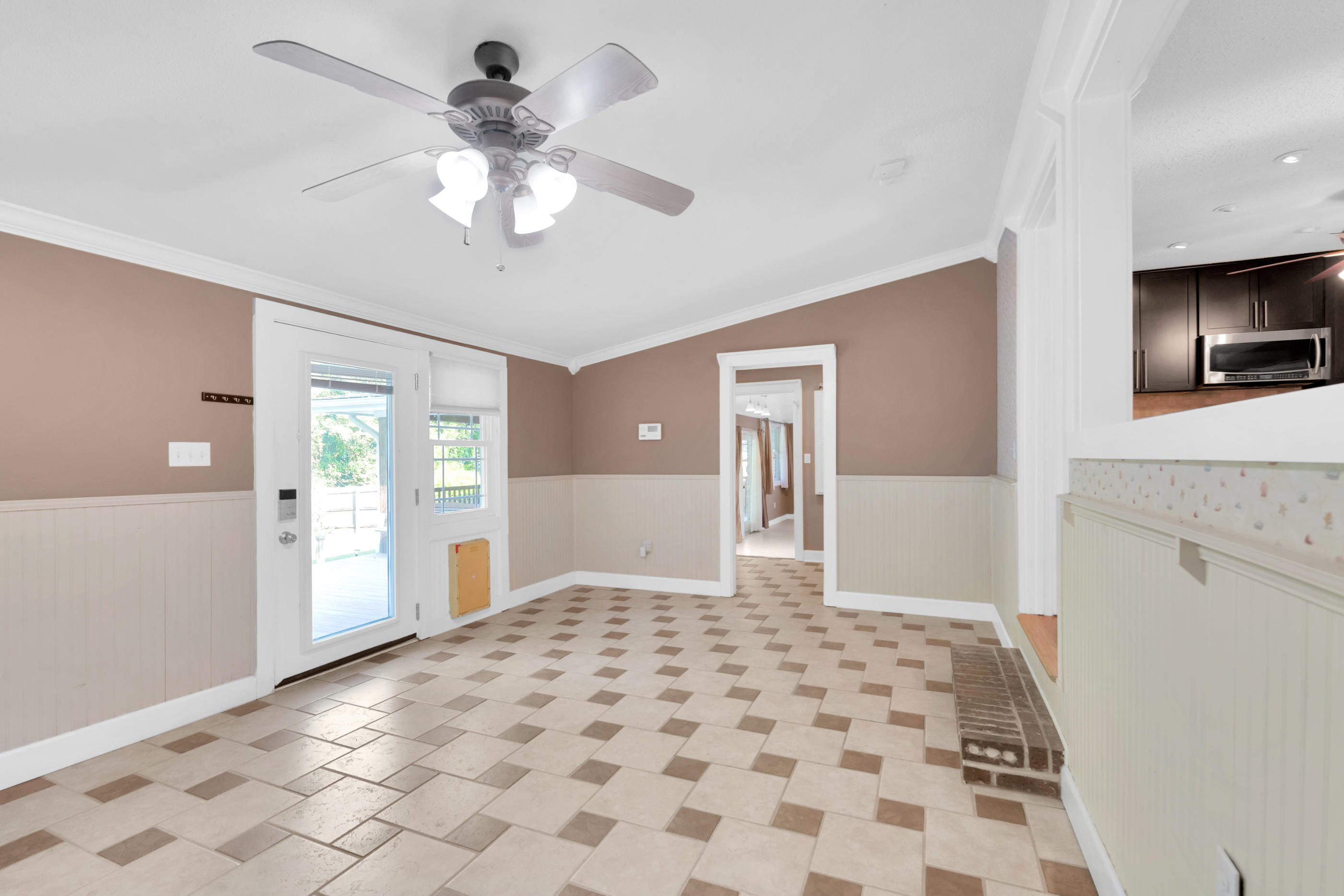 4 Roundabend Road Shalimar, FL 32579 - Photo 9 of 39 a view of a hallway with a chandelier fan and windows