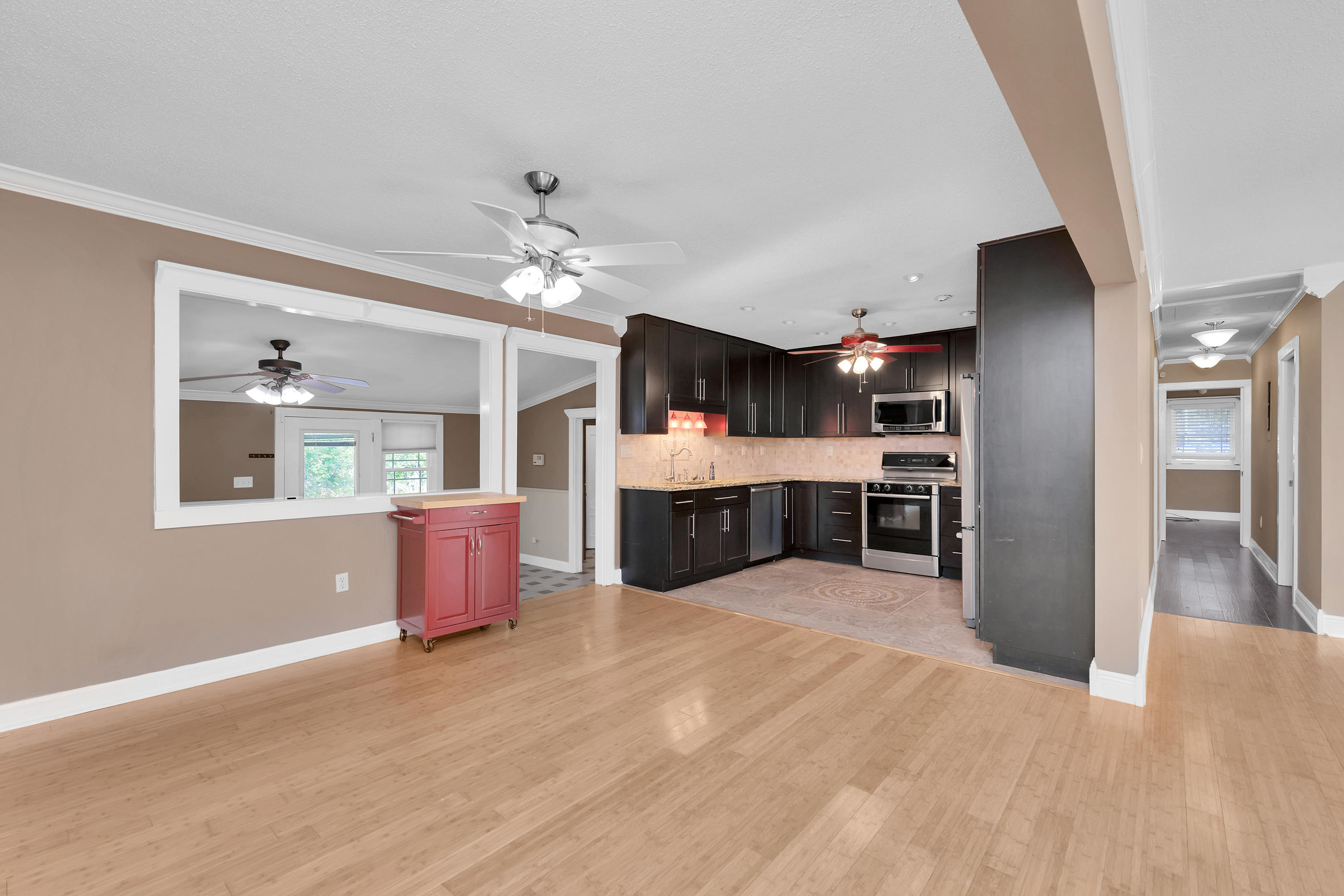 4 Roundabend Road Shalimar, FL 32579 - Photo 10 of 39 a large kitchen with stainless steel appliances kitchen island granite countertop a large kitchen island a stove and a sink
