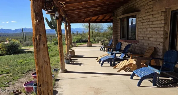 a view of living room with patio furniture and garden