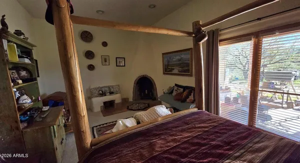 a bed room with a bed and a chair