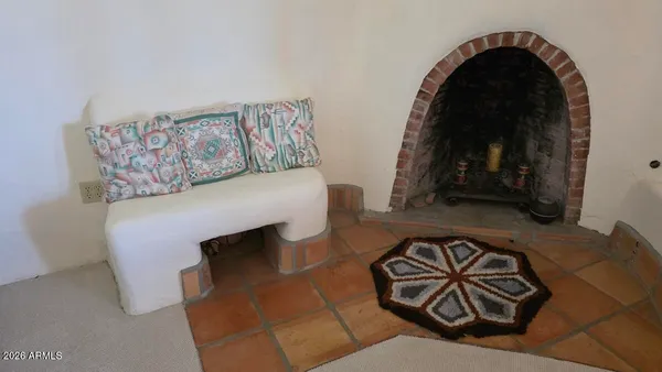 a view of kitchen with furniture and natural light