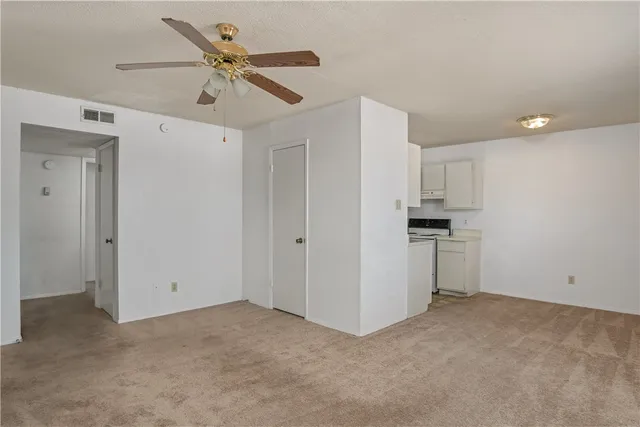 a view of kitchen with cabinets and stainless steel appliances