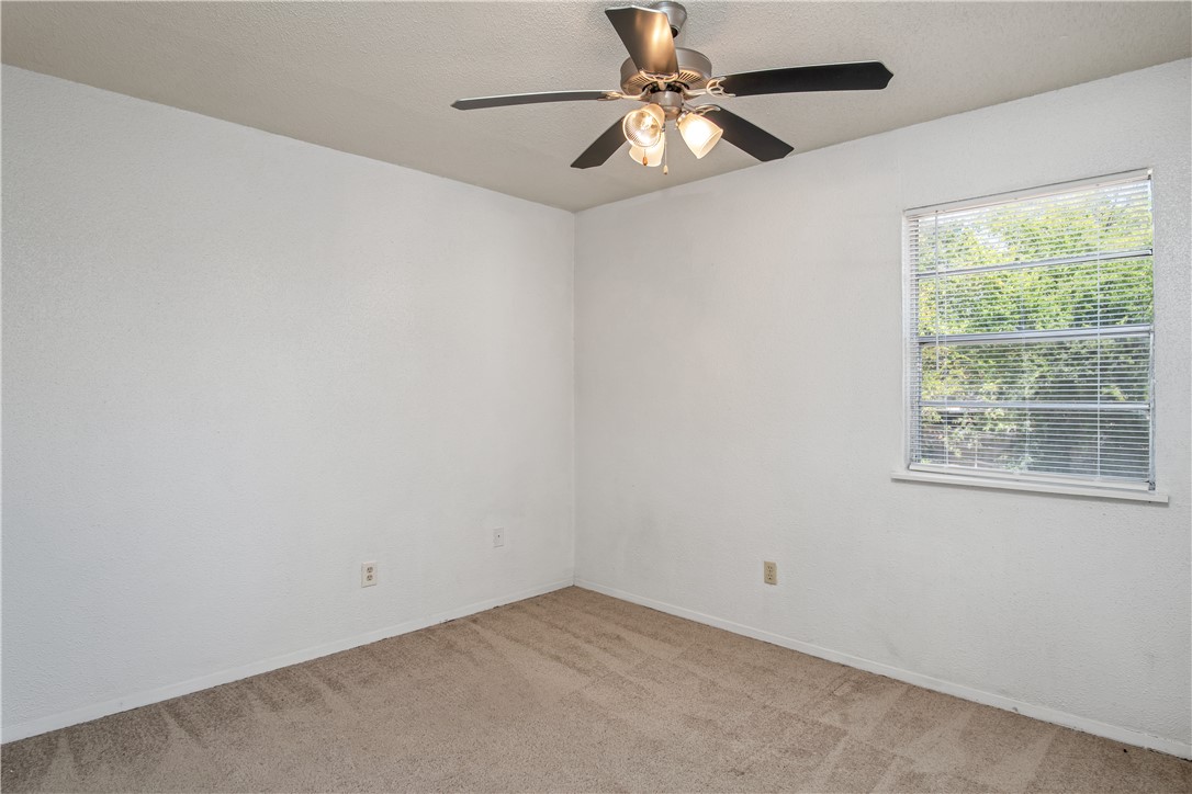 1501 Alpine Circle, Unit B College Station, TX 77840 - Photo 6 of 7 an empty room with a window