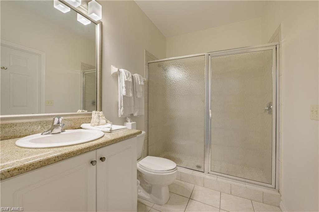 7940 Mahogany Run Lane, Unit 623 Naples, FL 34113 - Photo 12 of 25 a bathroom with a sink toilet and shower