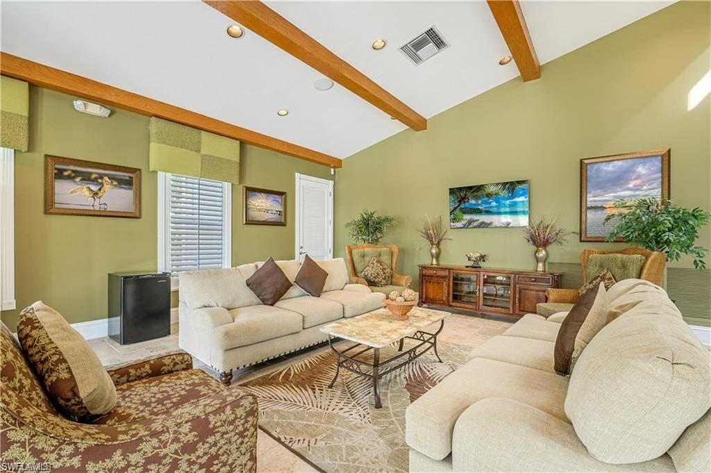 7940 Mahogany Run Lane, Unit 623 Naples, FL 34113 - Photo 15 of 25 a living room with furniture and a large window