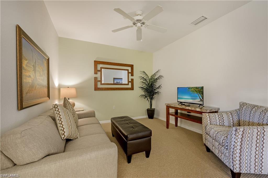 7940 Mahogany Run Lane, Unit 623 Naples, FL 34113 - Photo 2 of 25 a living room with furniture and a potted plant