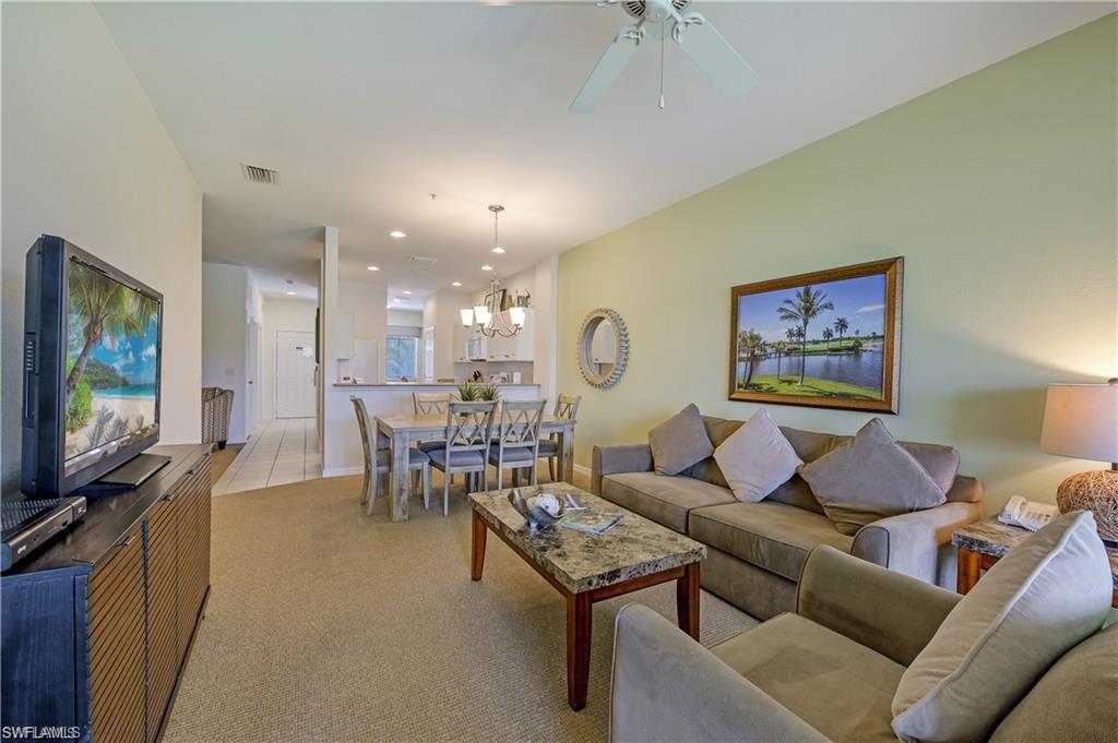 7940 Mahogany Run Lane, Unit 623 Naples, FL 34113 - Photo 3 of 25 a living room with furniture and a flat screen tv