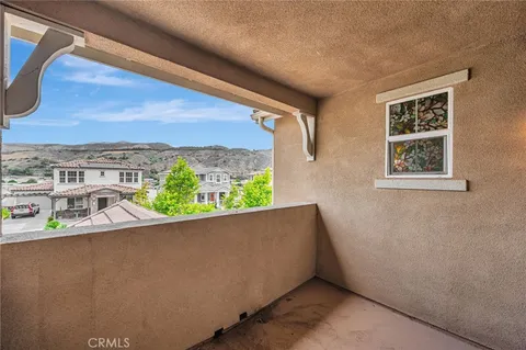 a view of a balcony with an outdoor space