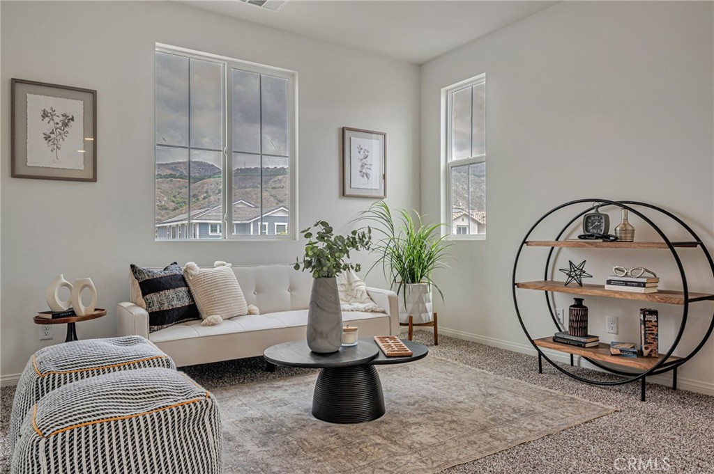 154 Azalea Street Fillmore, CA 93015 - Photo 9 of 37 a living room with furniture a rug and a potted plant