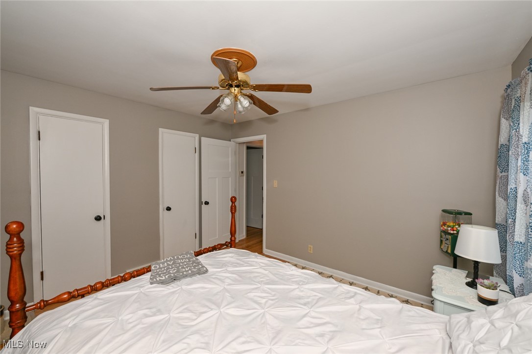 2150 Wise Road Green, OH 44720 - Photo 23 of 50 Bedroom featuring ceiling fan and wood flooring