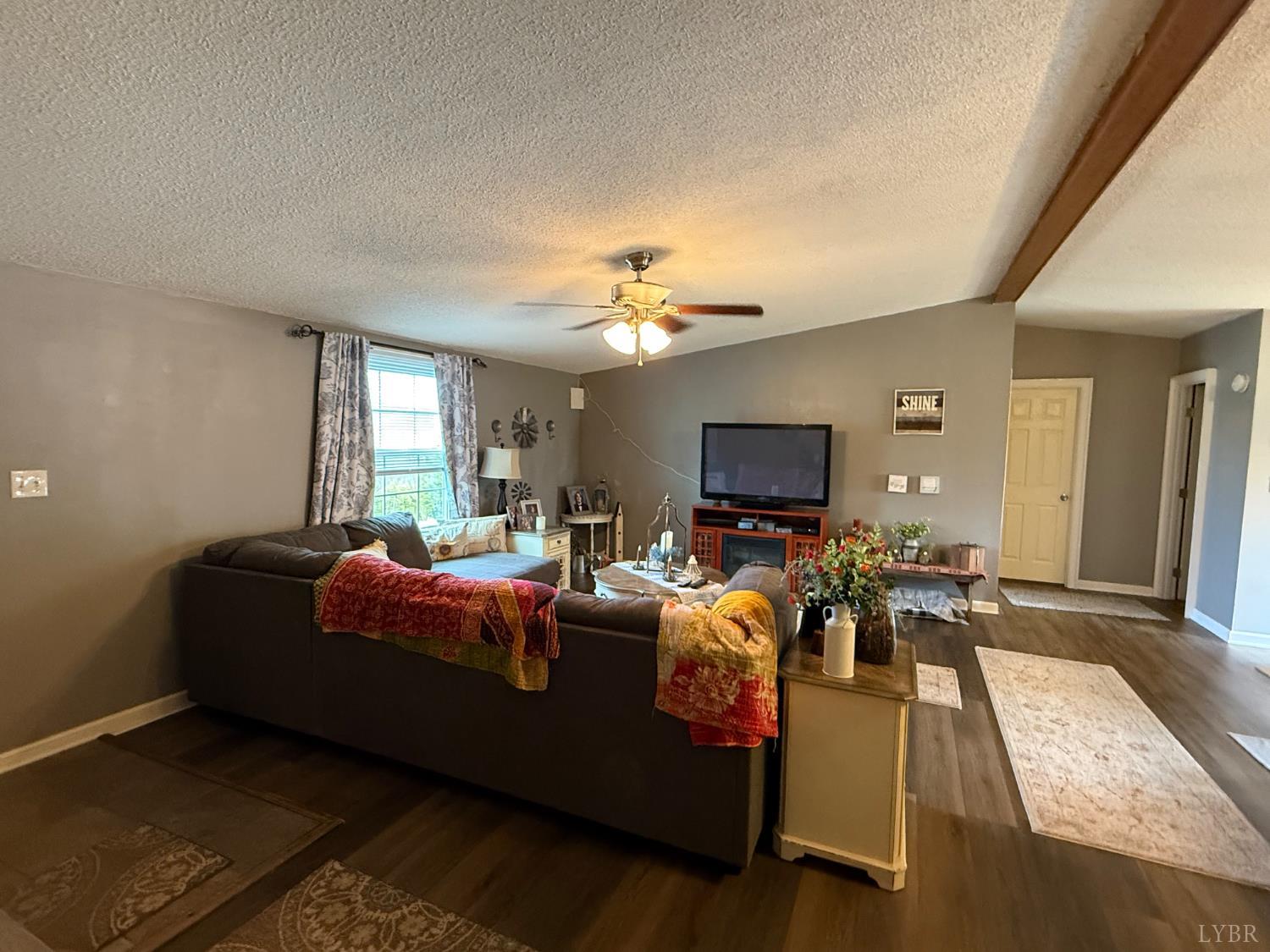 304 Plain Ridge Drive Evington, VA 24550 - Photo 12 of 16 a living room with furniture and a flat screen tv