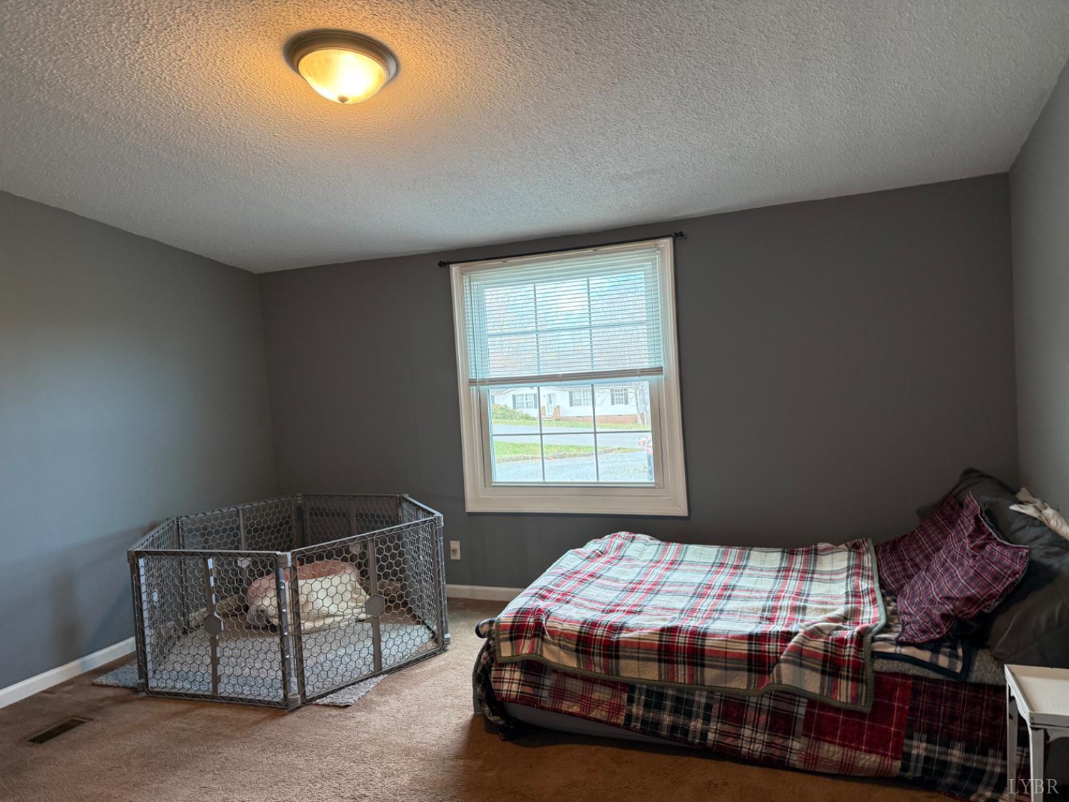 304 Plain Ridge Drive Evington, VA 24550 - Photo 15 of 16 a bedroom with a bed and window