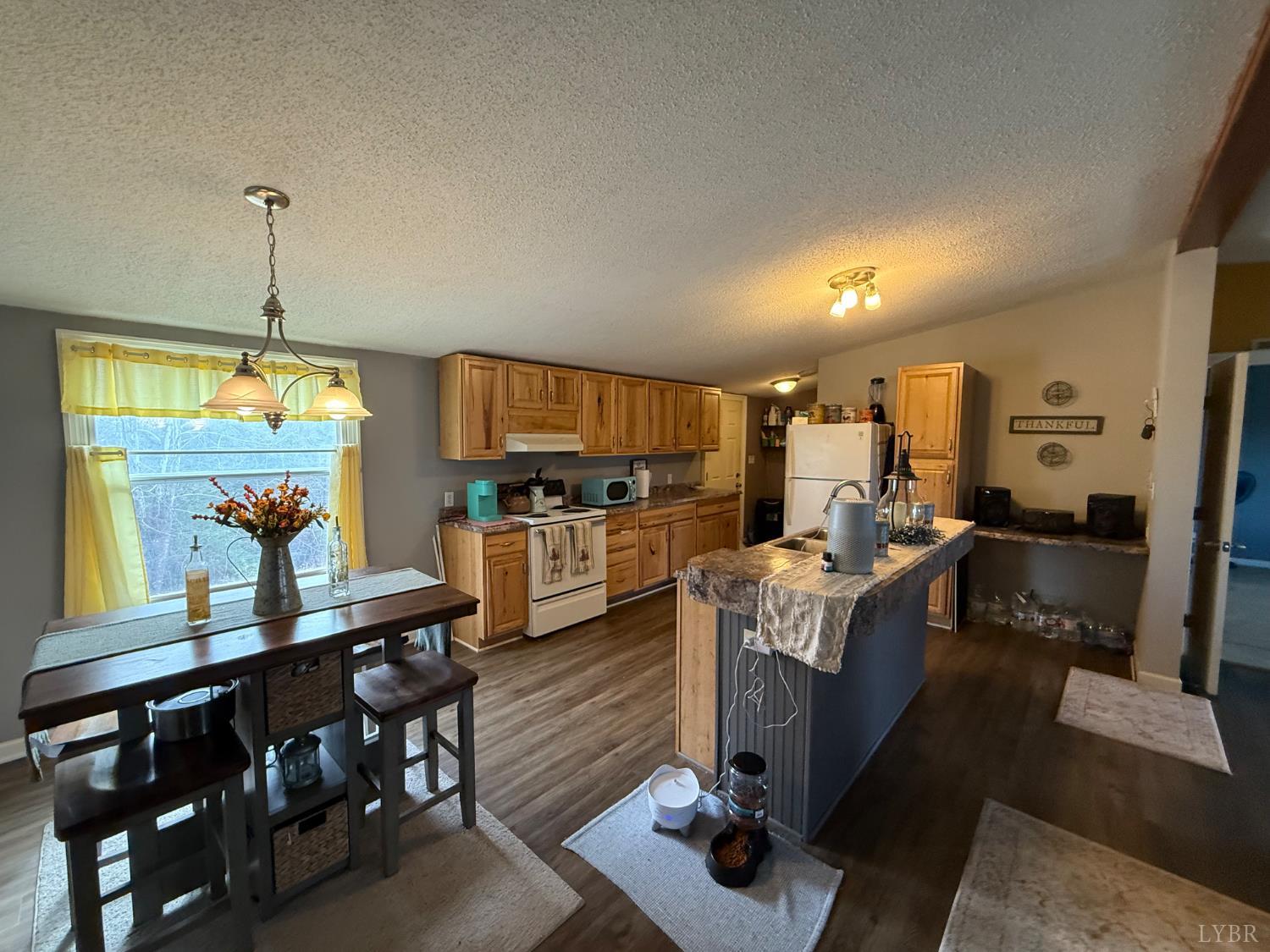 304 Plain Ridge Drive Evington, VA 24550 - Photo 3 of 16 a living room with furniture kitchen view and a wooden floor