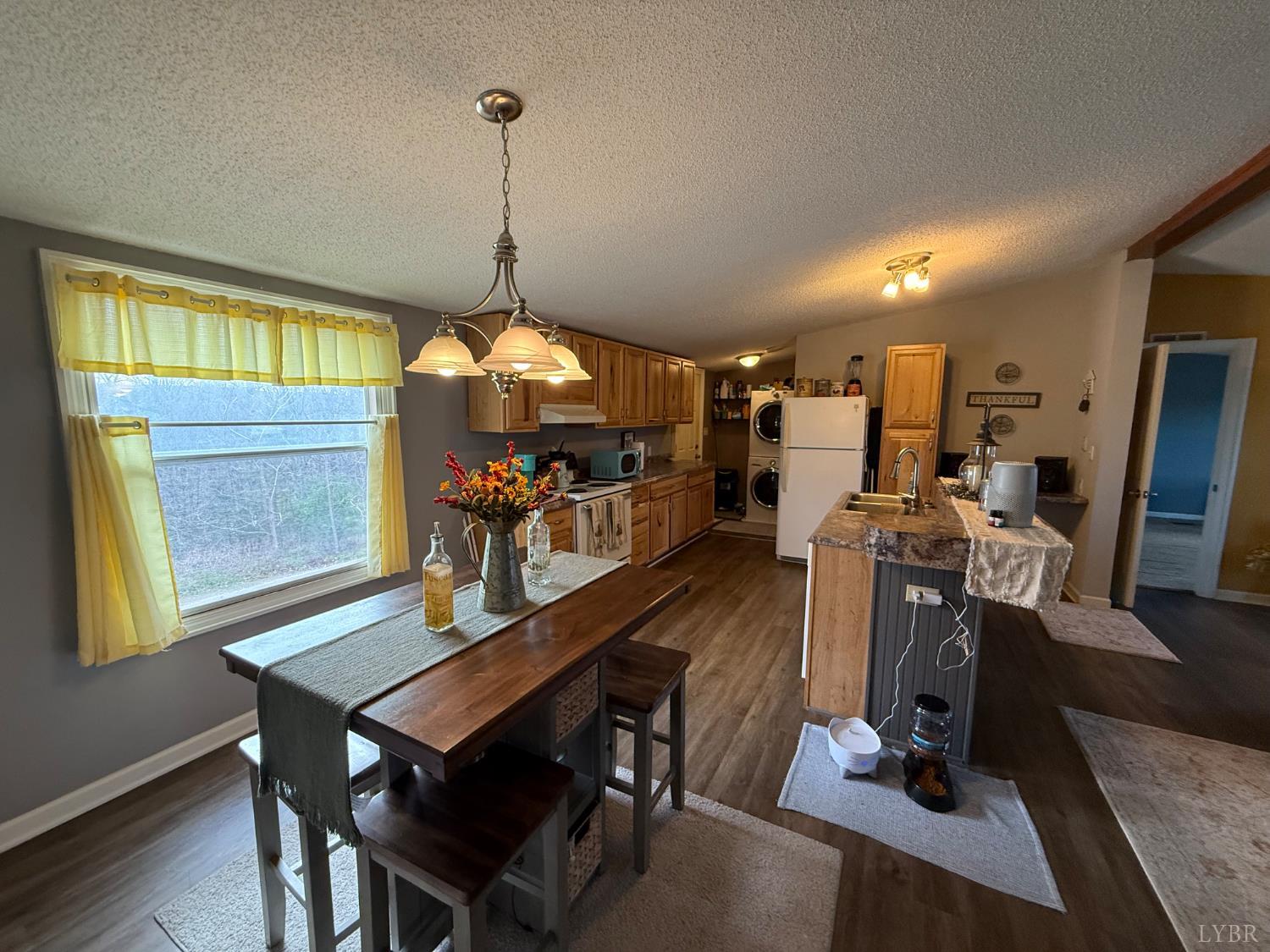 304 Plain Ridge Drive Evington, VA 24550 - Photo 4 of 16 a view of a dining room with furniture window and wooden floor