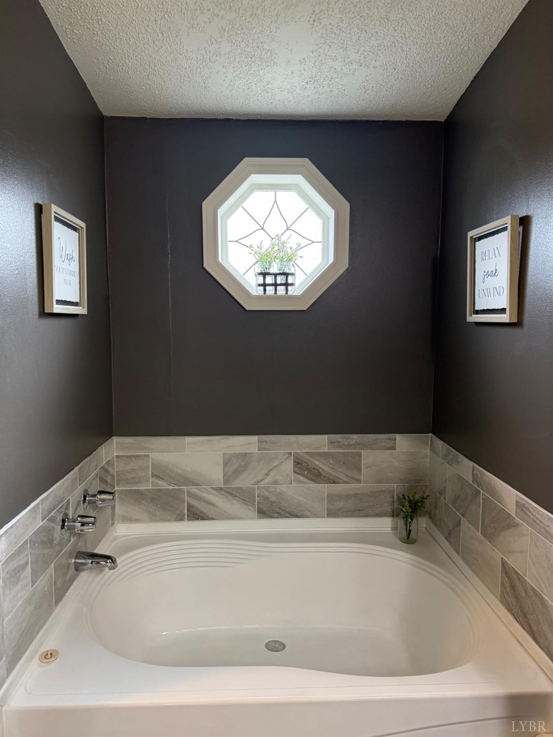 304 Plain Ridge Drive Evington, VA 24550 - Photo 9 of 16 a bathroom with a bathtub