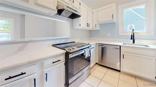 a white refrigerator freezer sitting inside of a kitchen