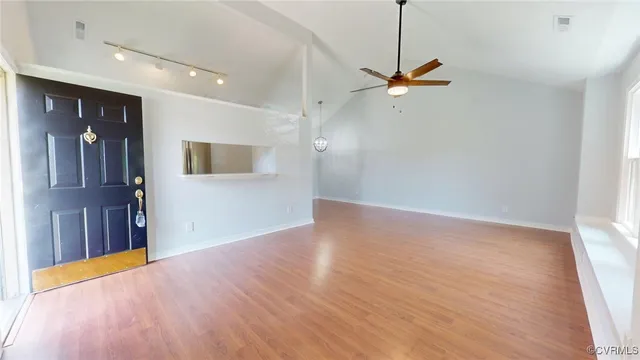 a kitchen with white cabinets sink and appliances