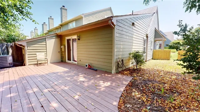 a view of a house with a yard and potted plants