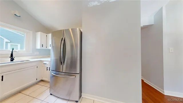 a kitchen with stainless steel appliances a refrigerator and cabinets