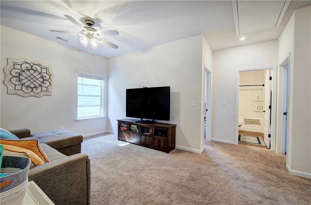 402 Perth Drive Cartersville, GA 30121 - Photo 11 of 31 a living room with furniture and a flat screen tv
