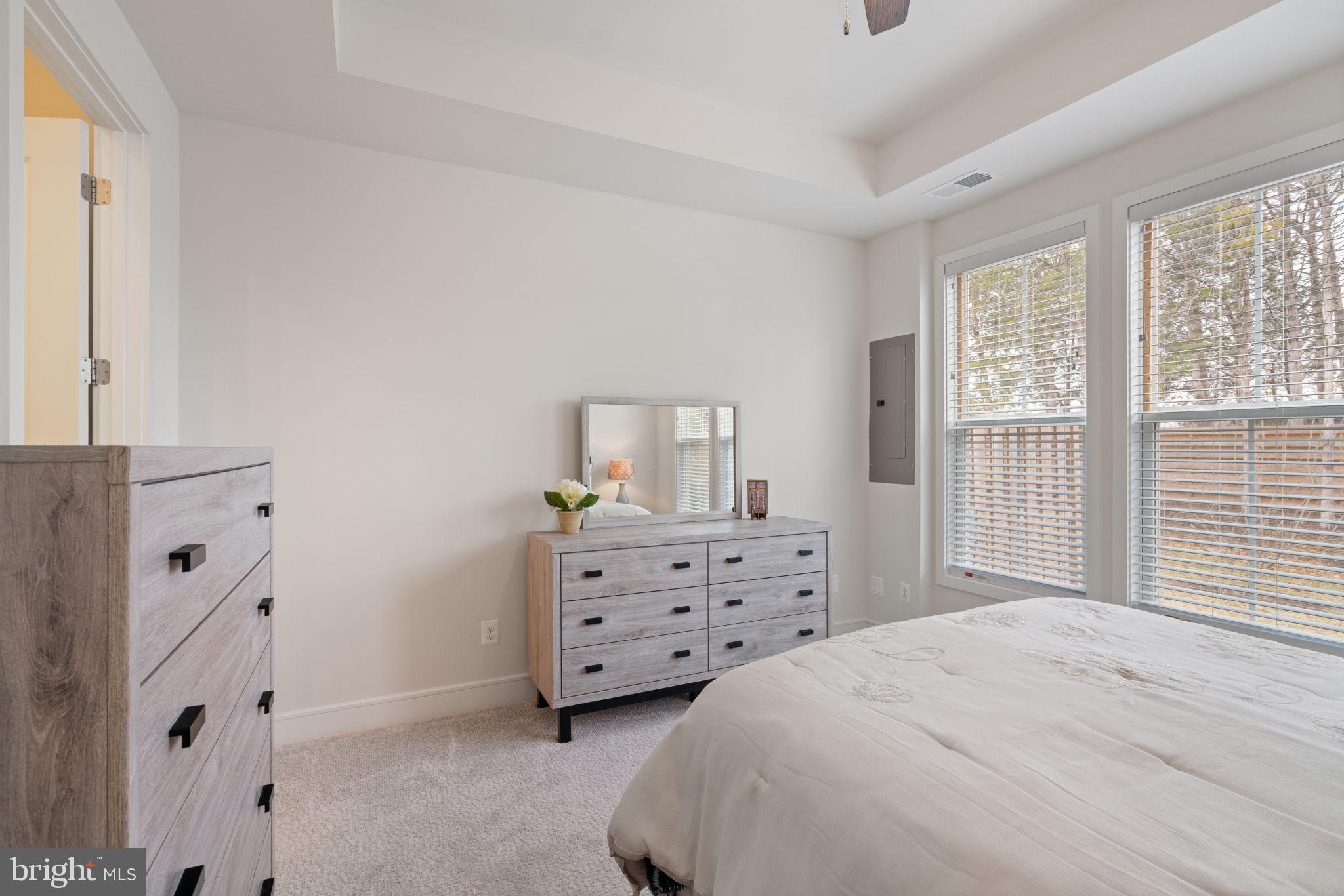 14712 Grand Cru Loop Gainesville, VA 20155 - Photo 16 of 46 a bedroom with a bed and dresser