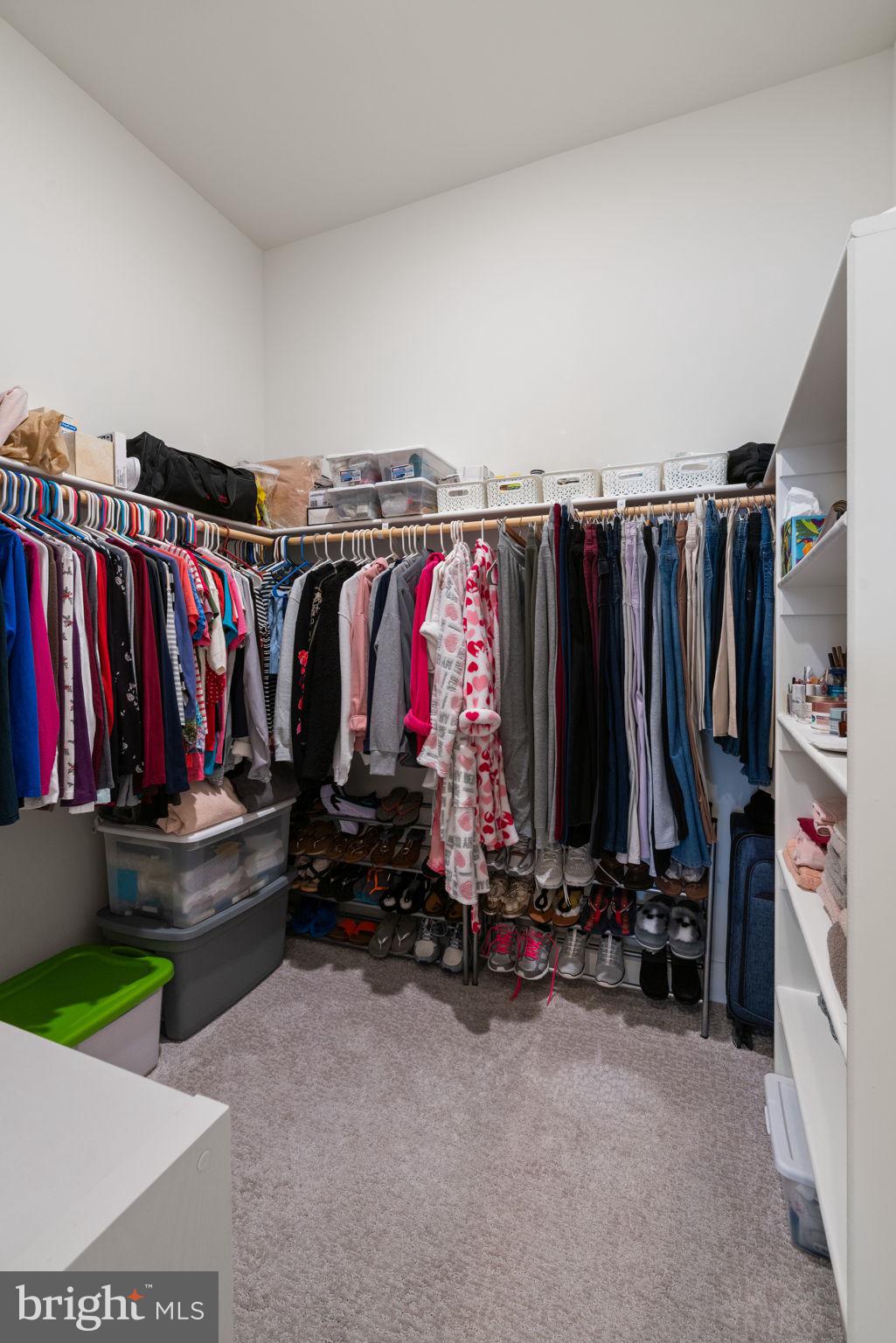 14712 Grand Cru Loop Gainesville, VA 20155 - Photo 20 of 46 a view of walk in closet with clothes