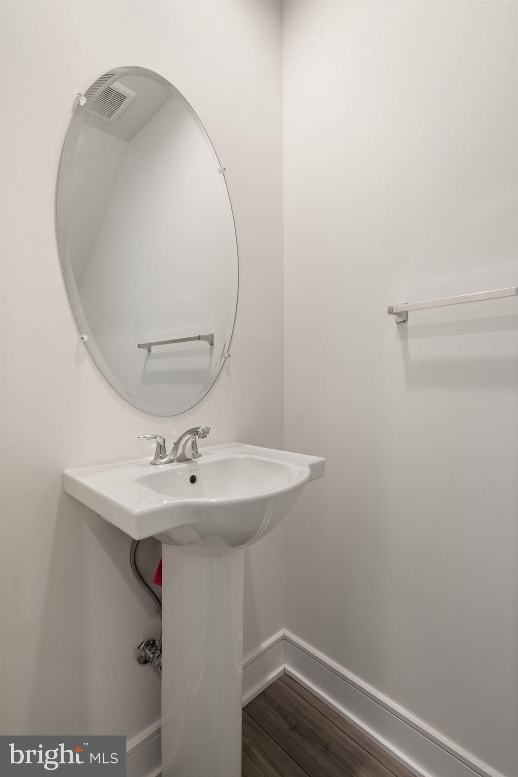 14712 Grand Cru Loop Gainesville, VA 20155 - Photo 21 of 46 a bathroom with a sink and mirror