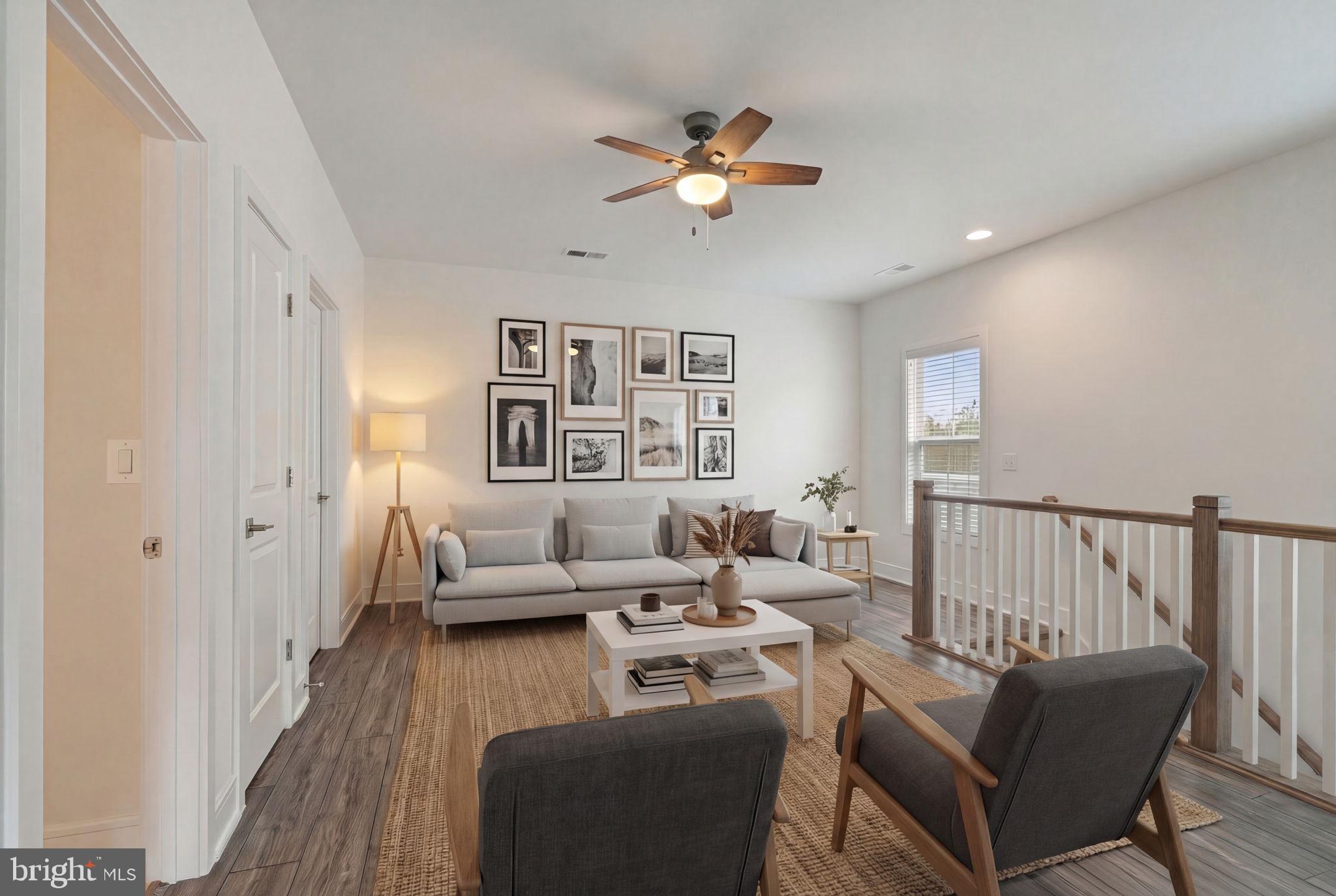 14712 Grand Cru Loop Gainesville, VA 20155 - Photo 24 of 46 a living room with furniture and wooden floor