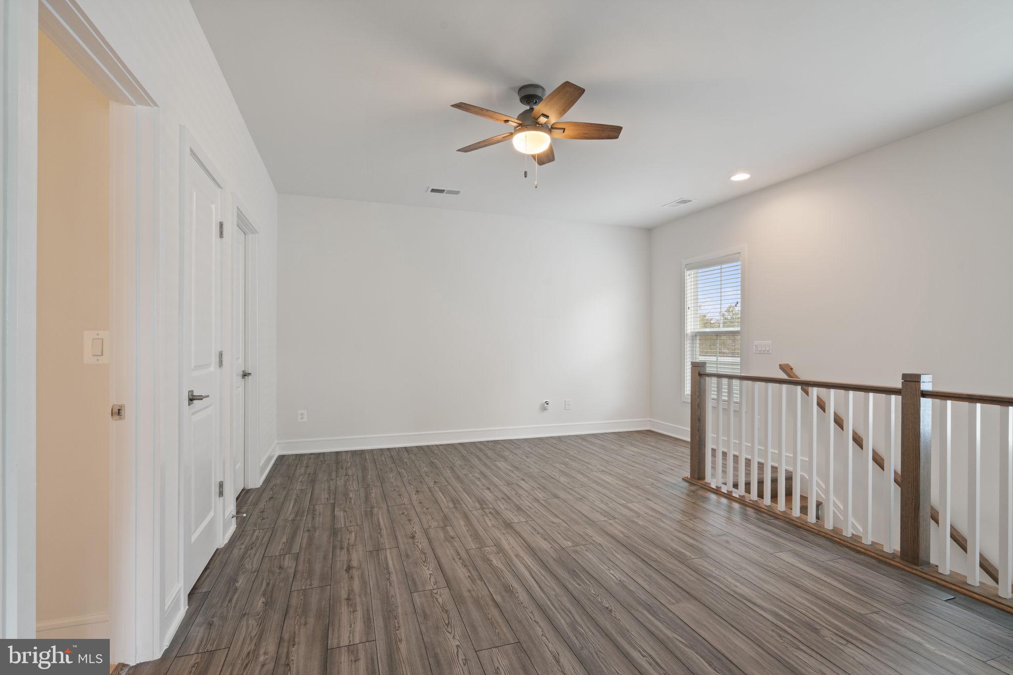 14712 Grand Cru Loop Gainesville, VA 20155 - Photo 25 of 46 a view of a livingroom with wooden floor