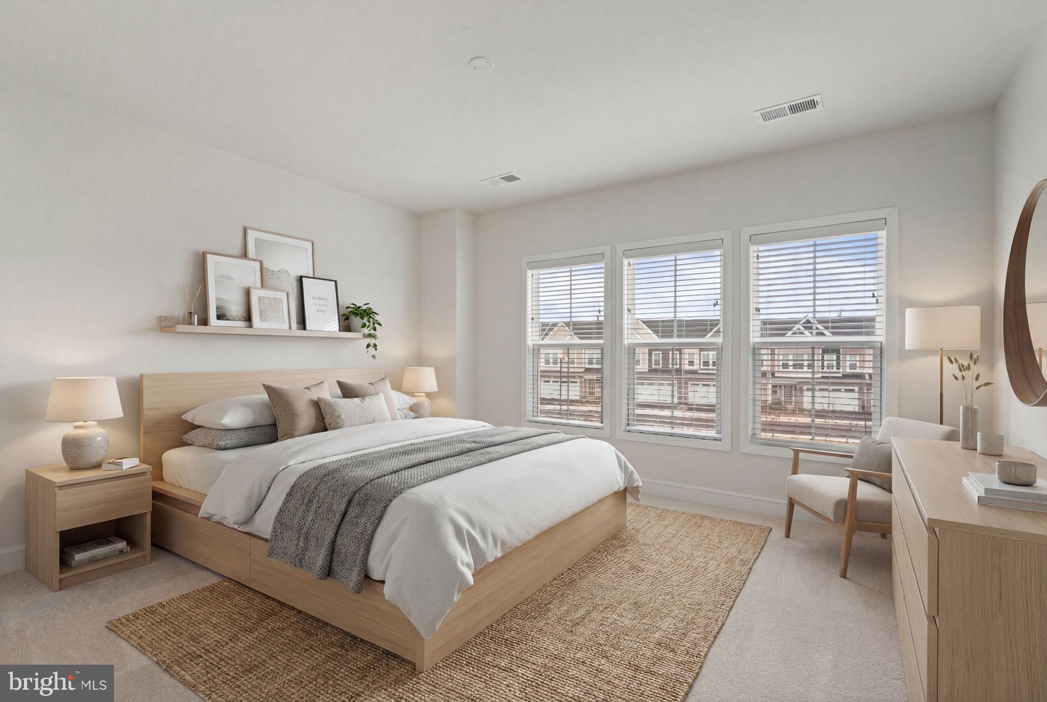 14712 Grand Cru Loop Gainesville, VA 20155 - Photo 27 of 46 a bedroom with a bed and a large window