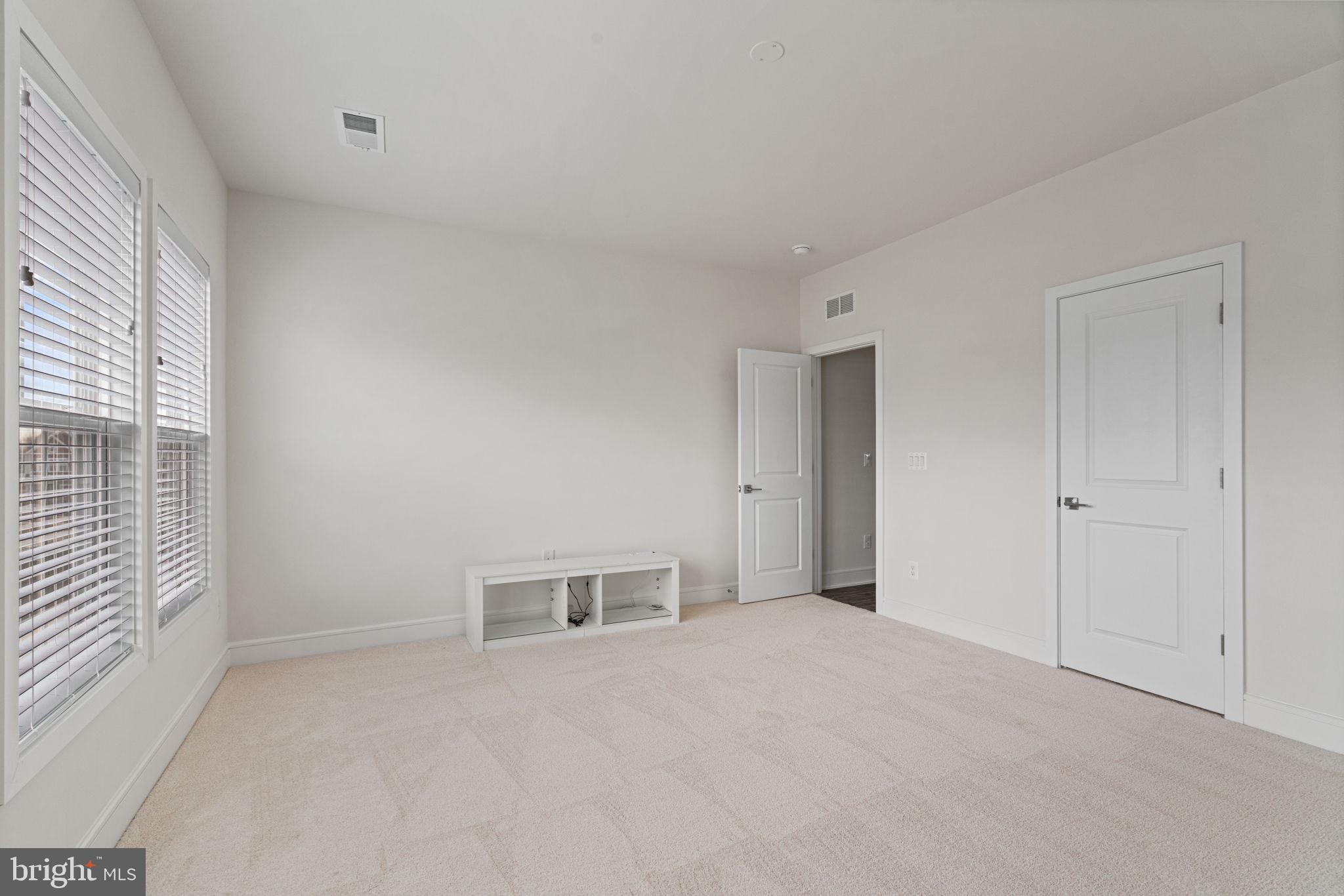 14712 Grand Cru Loop Gainesville, VA 20155 - Photo 29 of 46 a view of empty room with windows and wardrobe