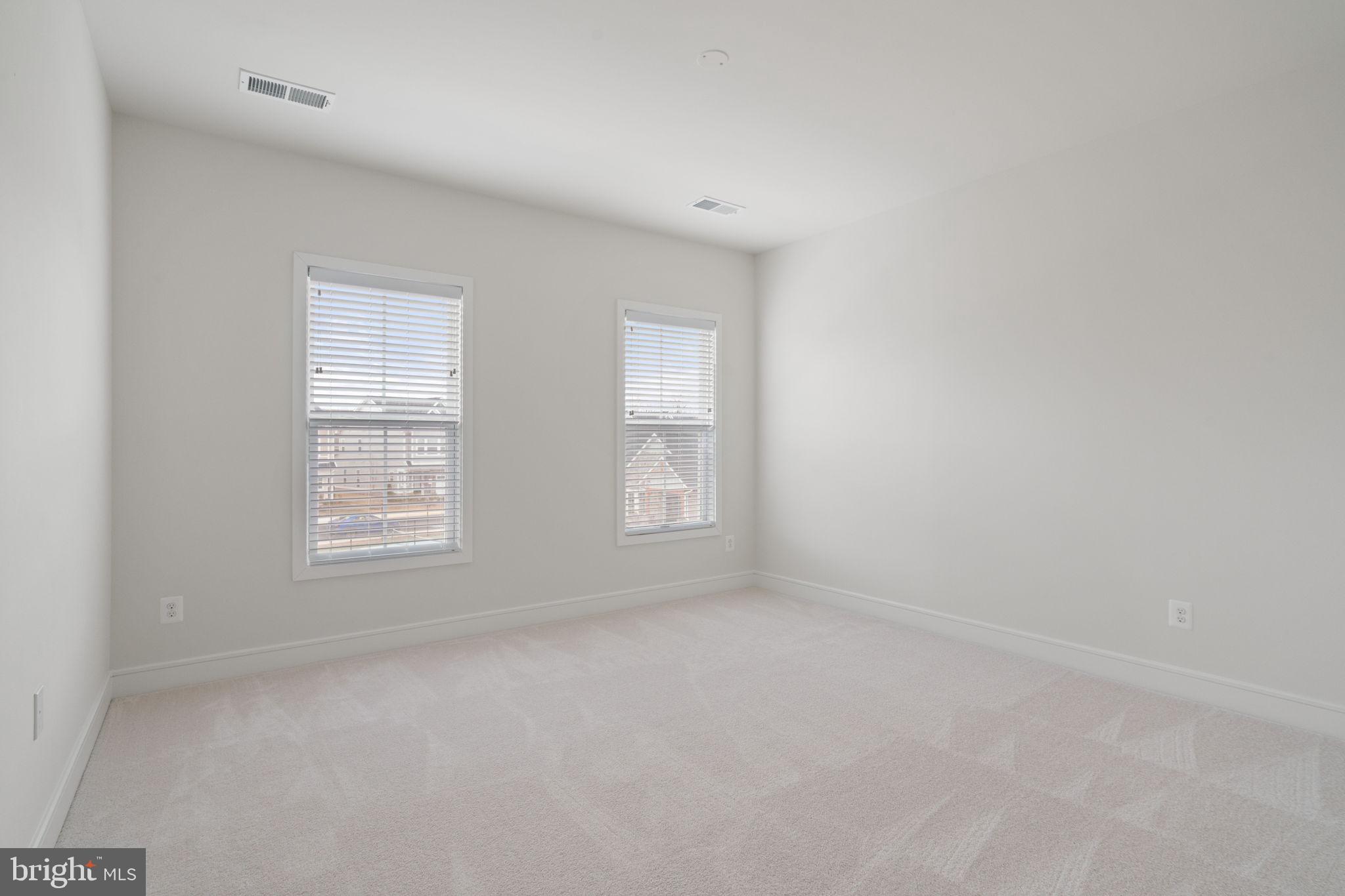 14712 Grand Cru Loop Gainesville, VA 20155 - Photo 31 of 46 an empty room with a window
