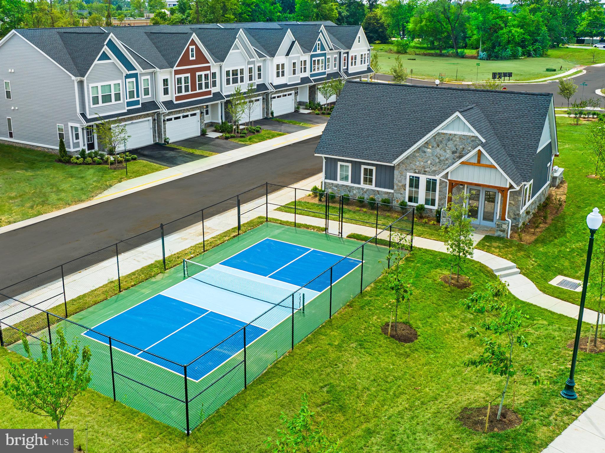 14712 Grand Cru Loop Gainesville, VA 20155 - Photo 41 of 46 a aerial view of a house with swimming pool and deck