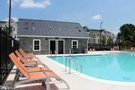 14712 Grand Cru Loop Gainesville, VA 20155 - Photo 43 of 46 a view of a house with backyard porch and sitting area