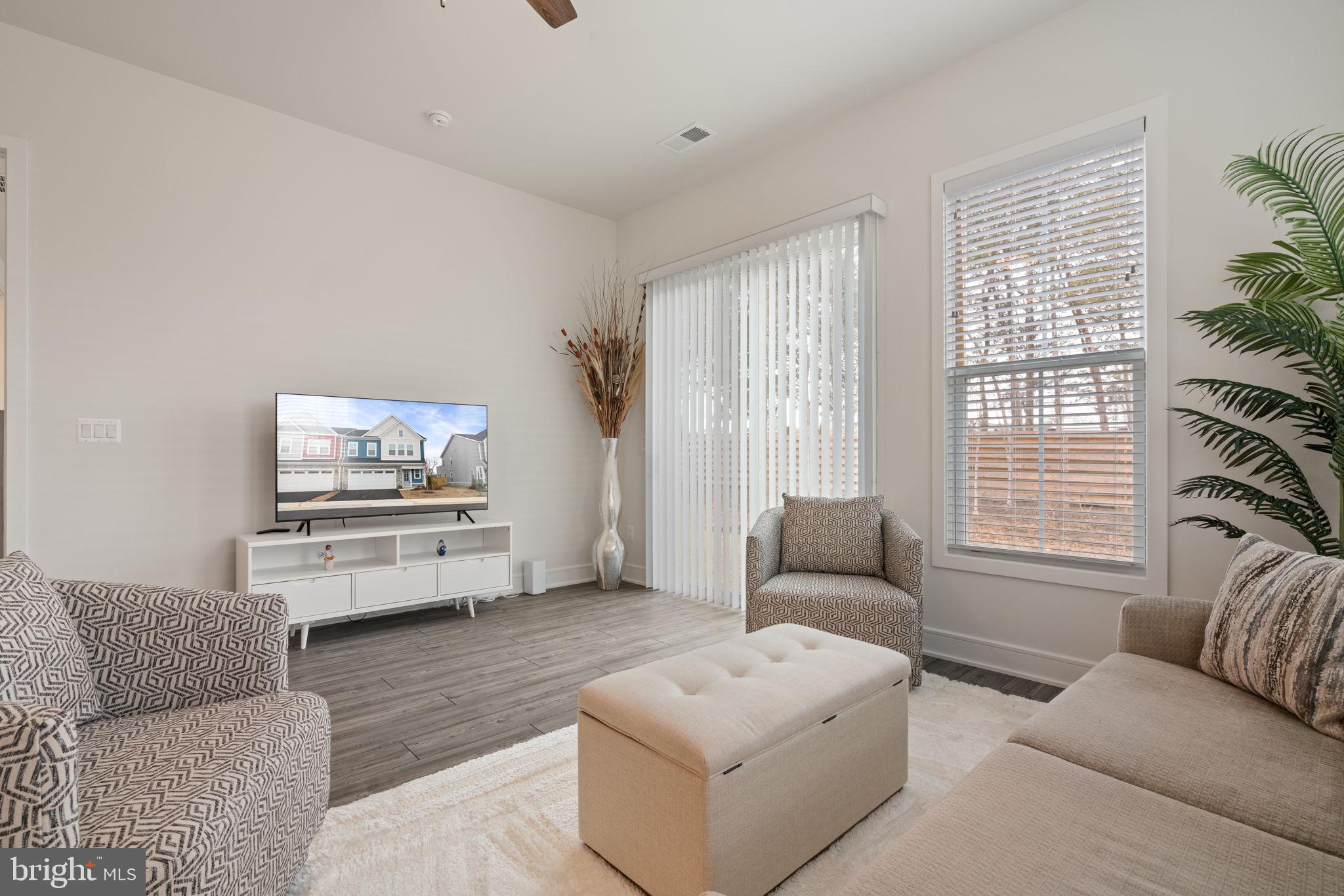 14712 Grand Cru Loop Gainesville, VA 20155 - Photo 10 of 46 a living room with furniture and a window