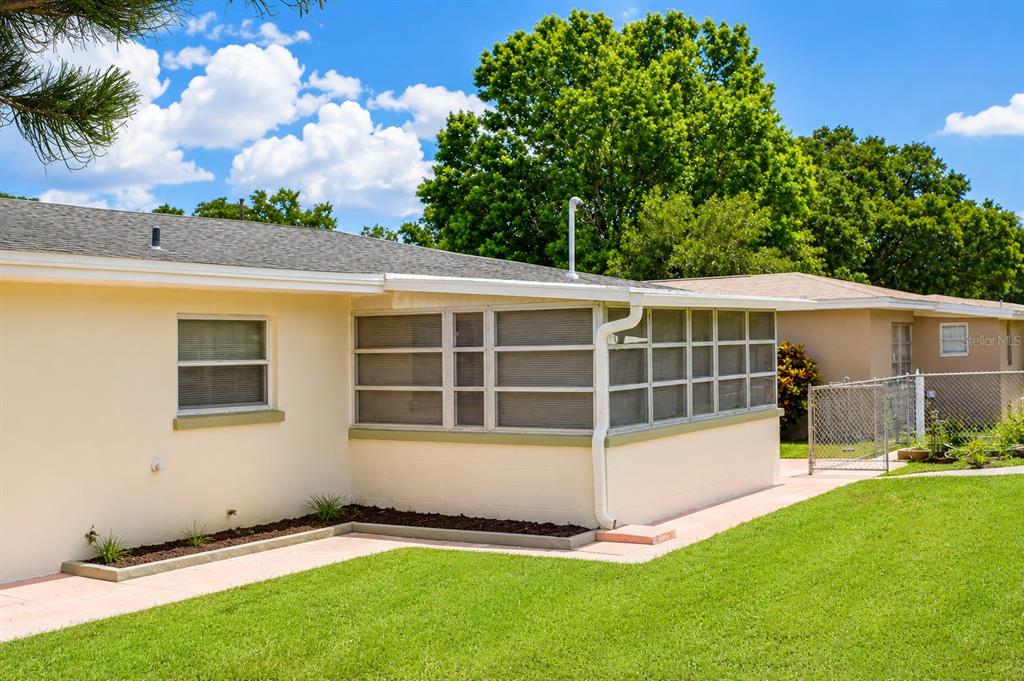 1559 Barry Road Clearwater, FL 33756 - Photo 18 of 20 a view of a house with a backyard