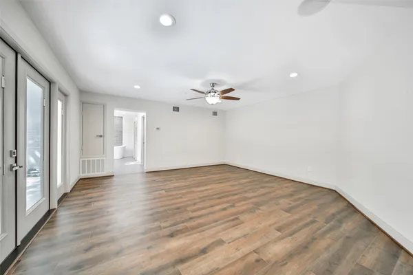a bathroom with a bathtub sink and mirror